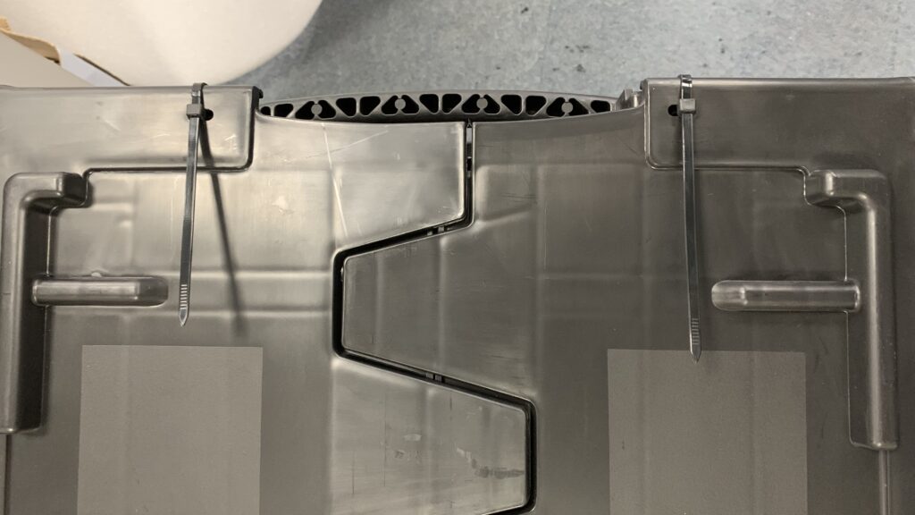 Cable ties securing the box lid
